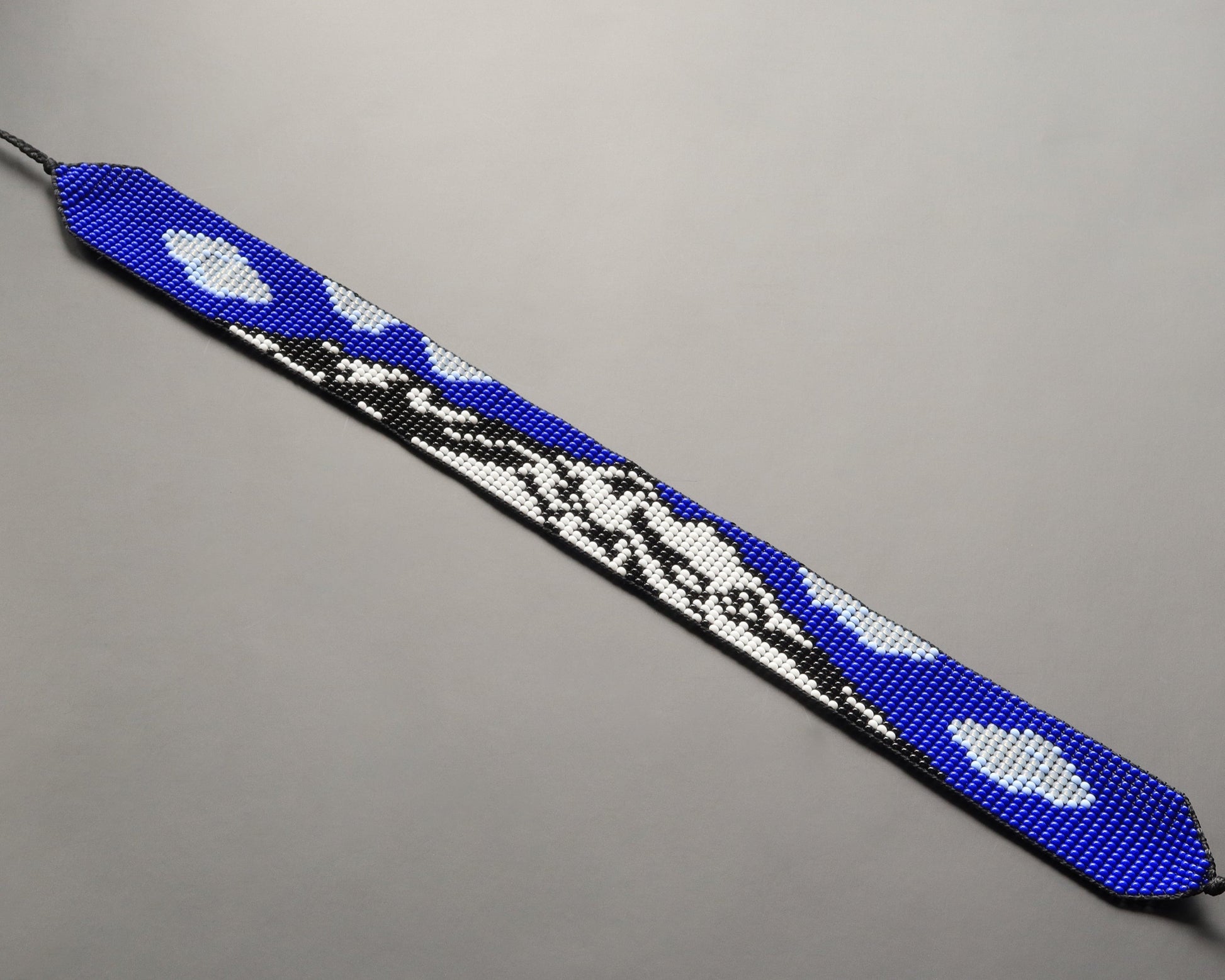Comely UA beaded gerdan necklace with Mont Blanc mountain design in blue, white, and black Czech seed beads.