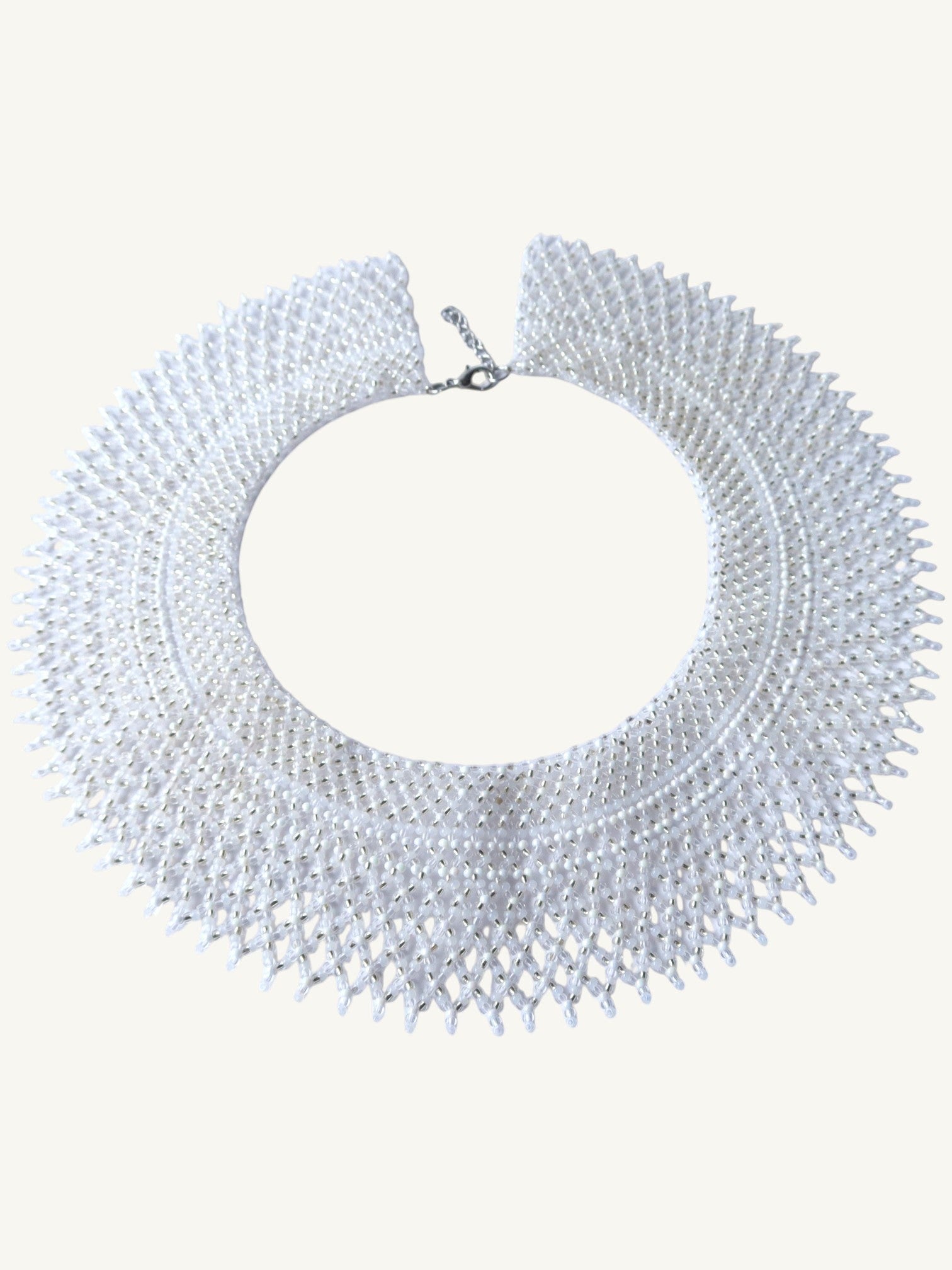 Comely UA "Moonlit Dew" silyanka choker necklace in white, silver, and transparent Czech seed beads. Circular woven design with adjustable clasp.