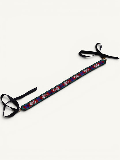 Comely UA Neresnytsia gerdan with red, blue, and green diamond beadwork and black velvet ties.