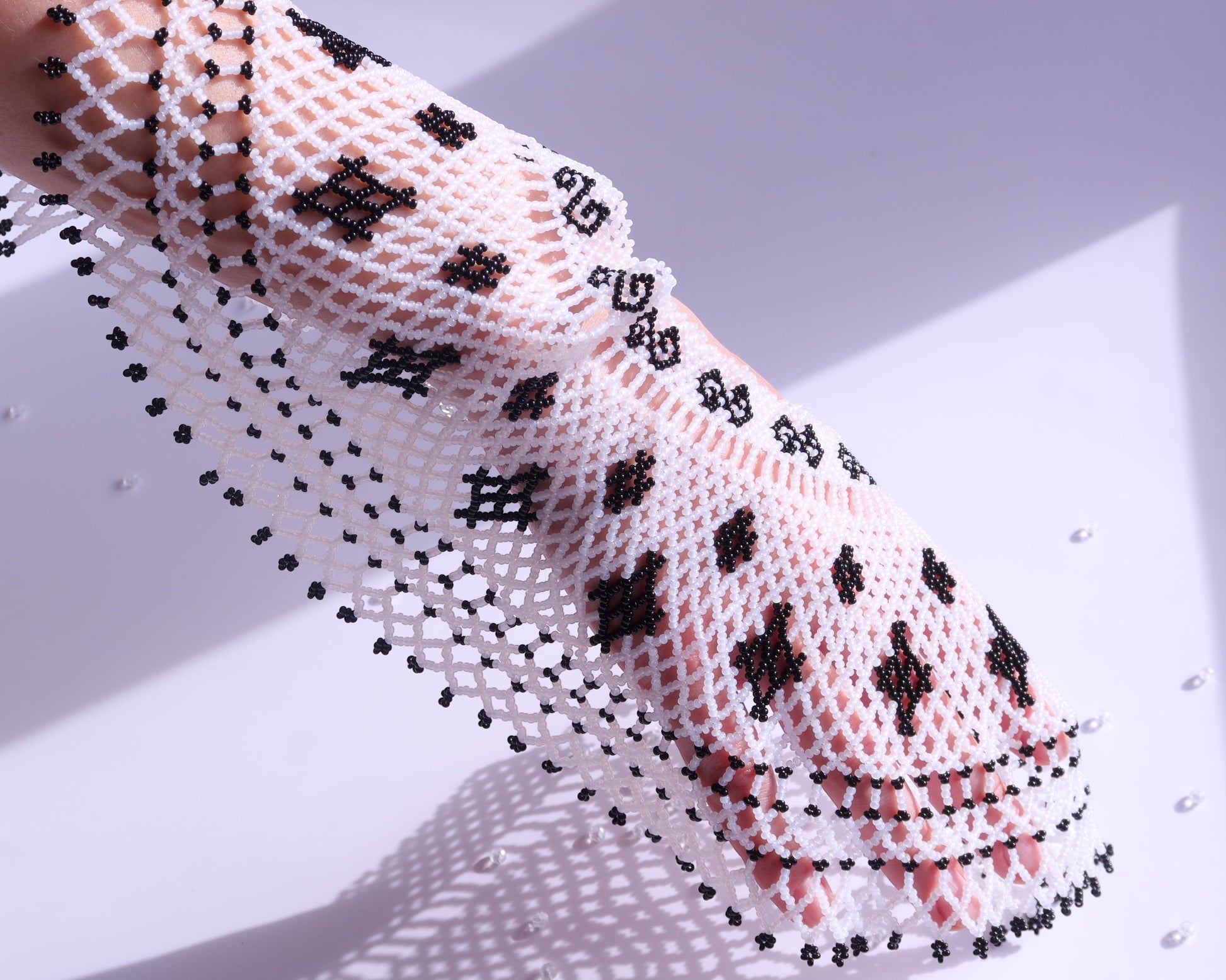 Comely UA Primla beaded necklace in black and white with diamond and spiral patterns. Czech seed beads.