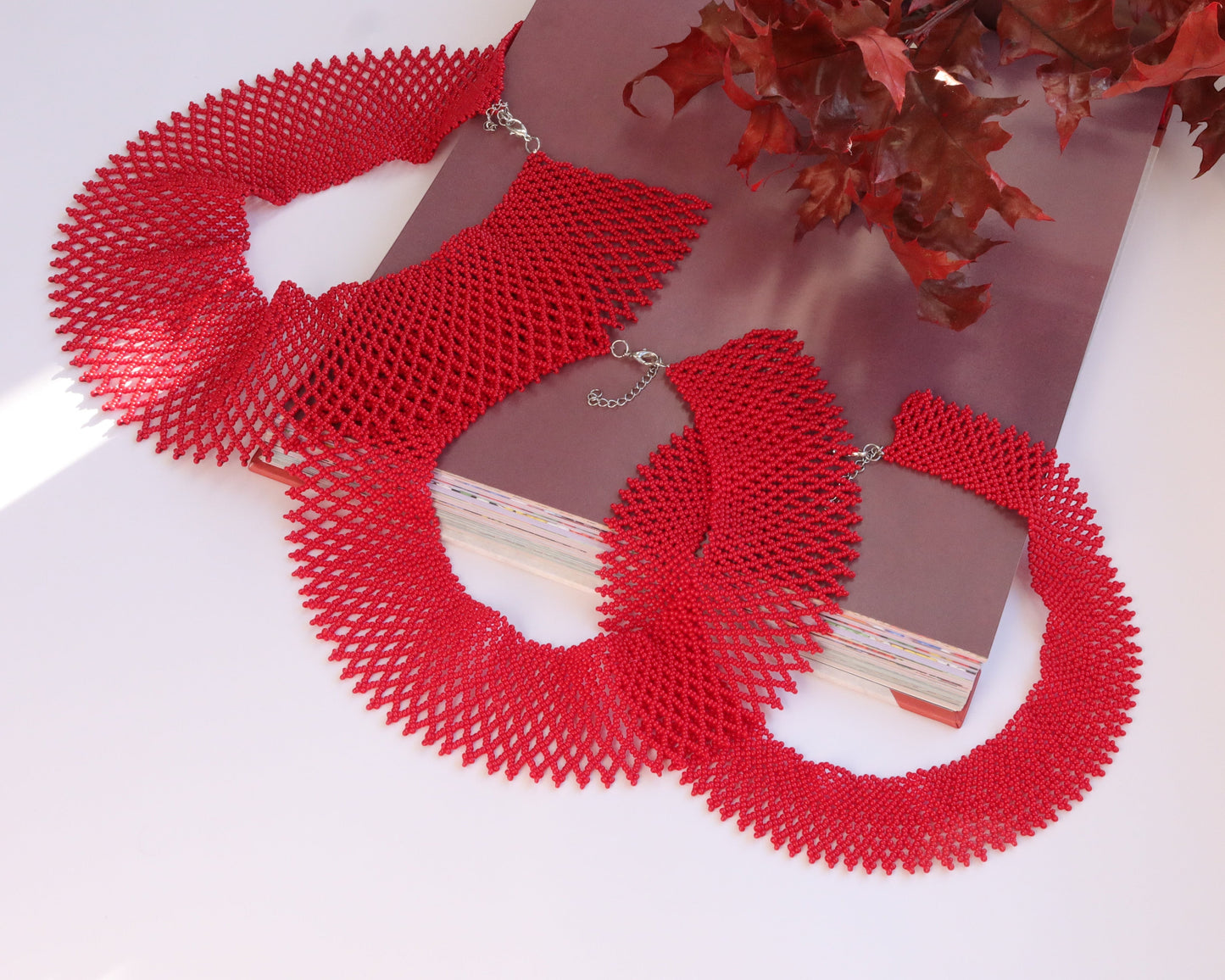 Comely UA red beaded necklace, a modern take on a traditional Ukrainian silyanka. Intricate beadwork with a diamond pattern.