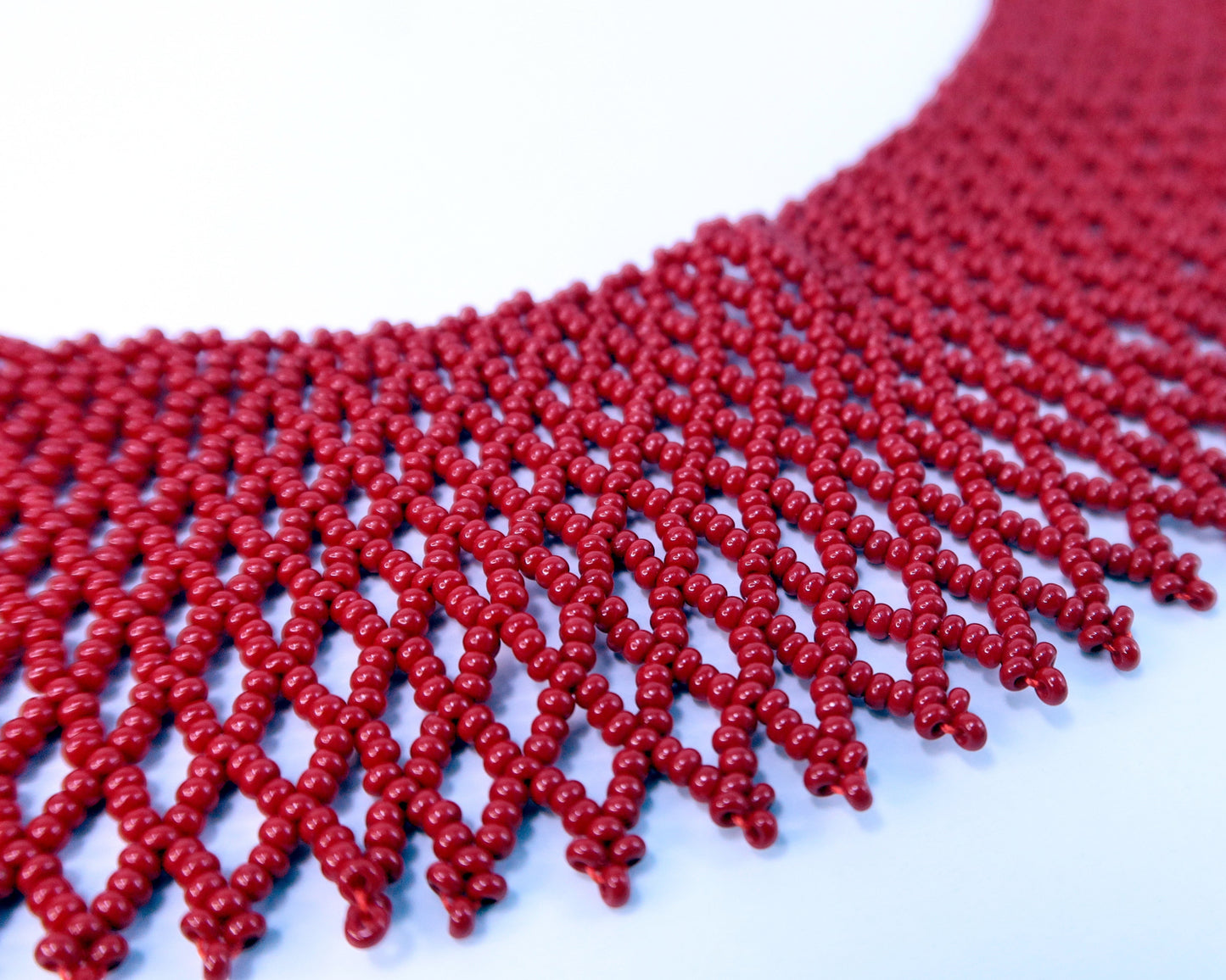 Comely UA red beaded necklace, a traditional Ukrainian silyanka choker with a diamond-shaped net pattern.