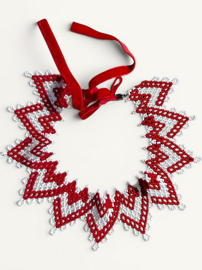 Comely UA red and white zigzag beaded silyanka necklace with velvet ribbon ties. Symbolizes warmth and renewal.