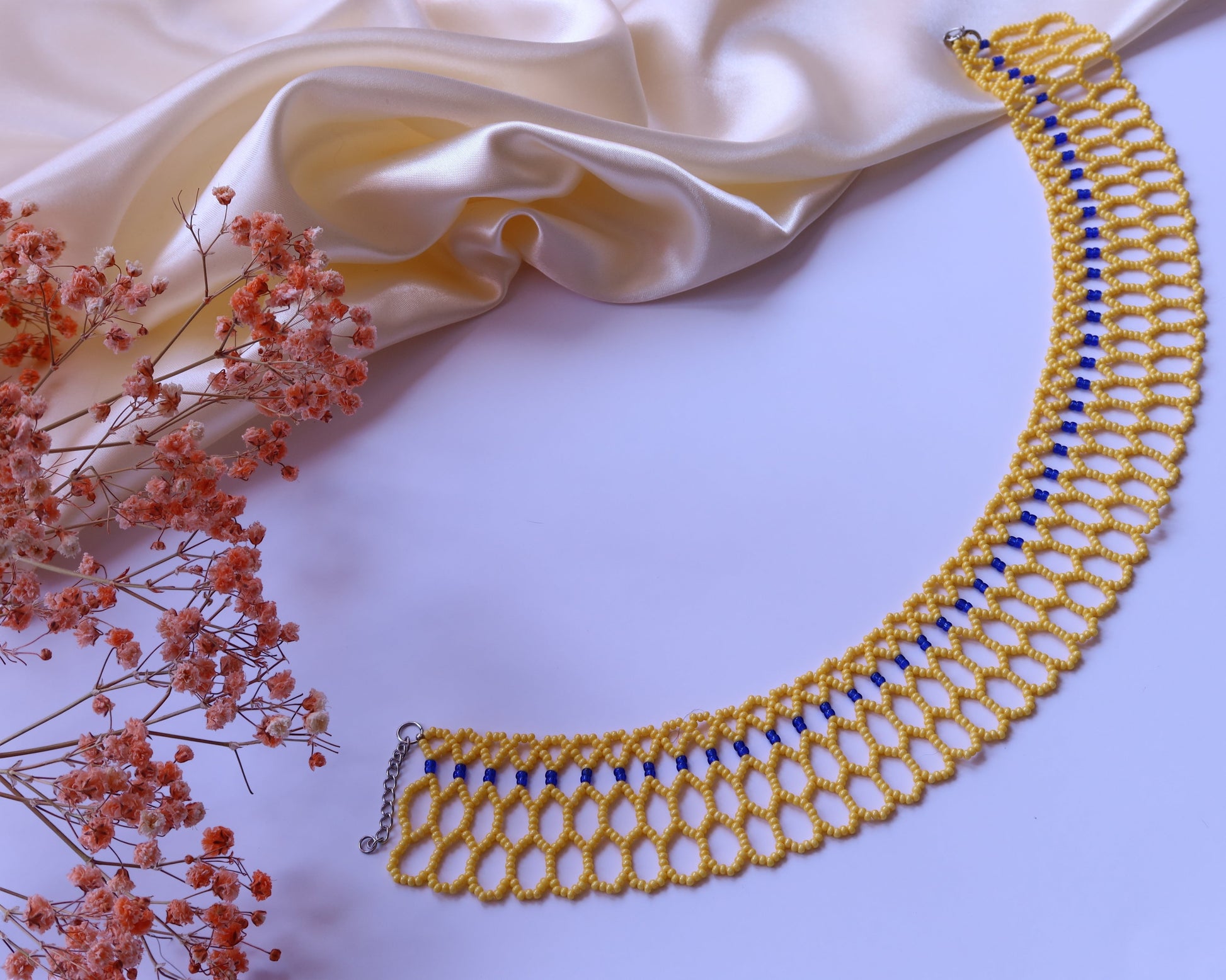 Comely UA Silyanka "Bee Nest" yellow and blue beaded lace choker necklace with honeycomb pattern.