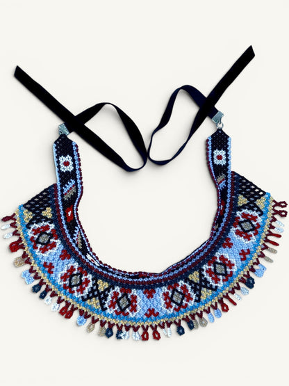 Comely UA Two-part Silyanka Ladder beaded necklace with black velvet ribbons, featuring geometric patterns in red, blue, white, and yellow.