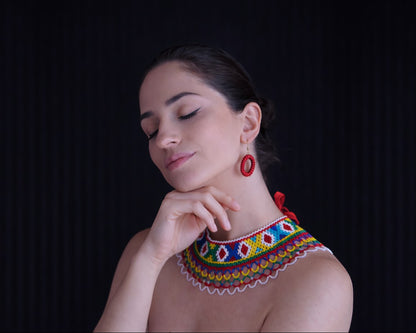 Comely UA Silyanka Lado beaded necklace with red, yellow, blue, green, and white geometric patterns and openwork lattice edge.