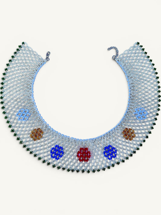 Comely UA Silyanka Zharda necklace, a replica of a 20th-century Vinnytsia region talisman. Features a light blue mesh with red, blue, yellow, and green beaded floral motifs.
