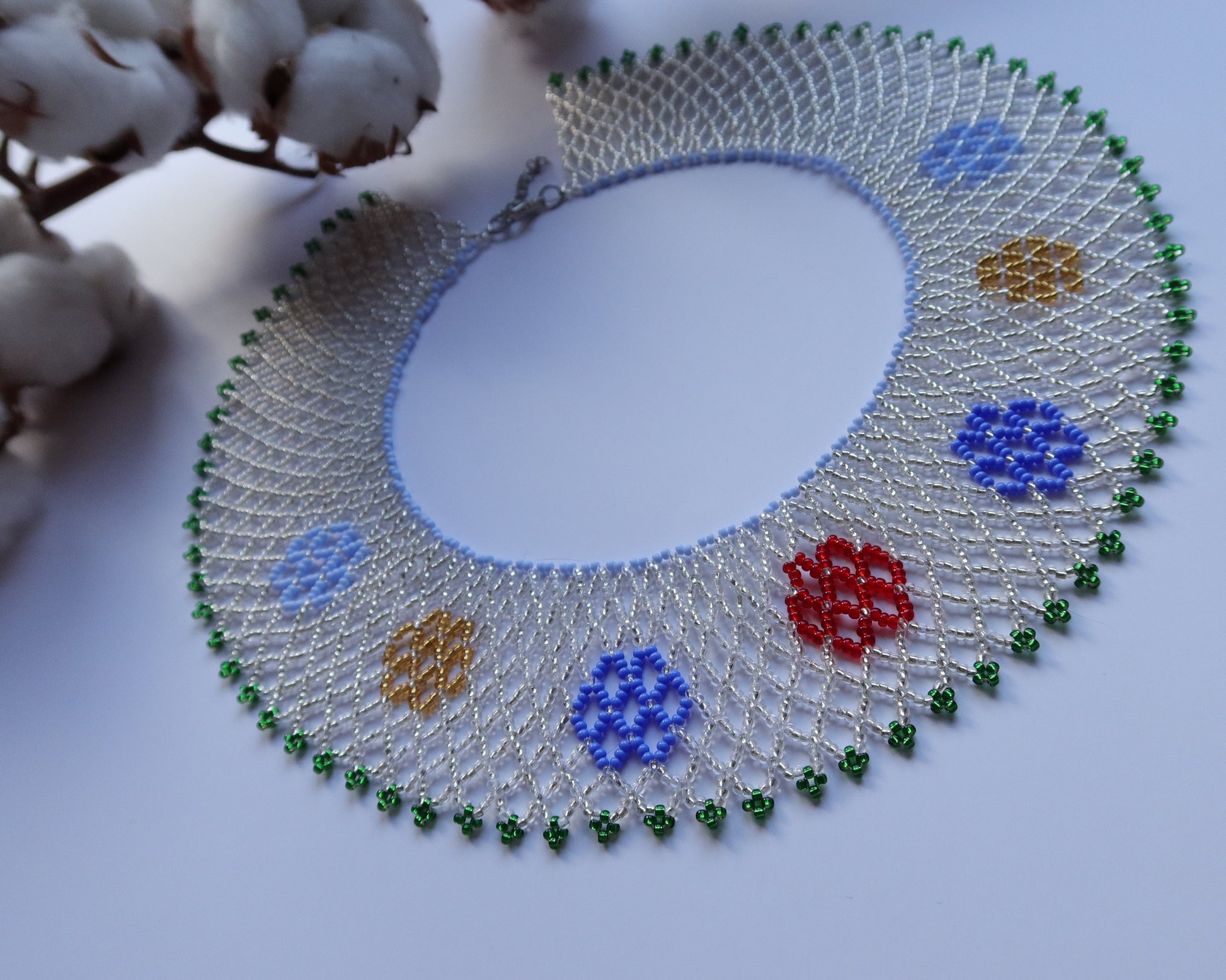 Comely UA Silyanka Zharda beaded necklace with red, blue, yellow, and green accents. Mesh design.