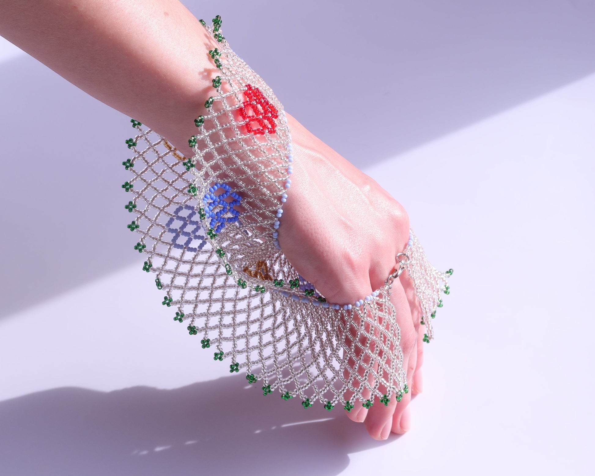 Comely UA Silyanka Zharda beaded necklace with red, blue, and yellow floral motifs and green border.