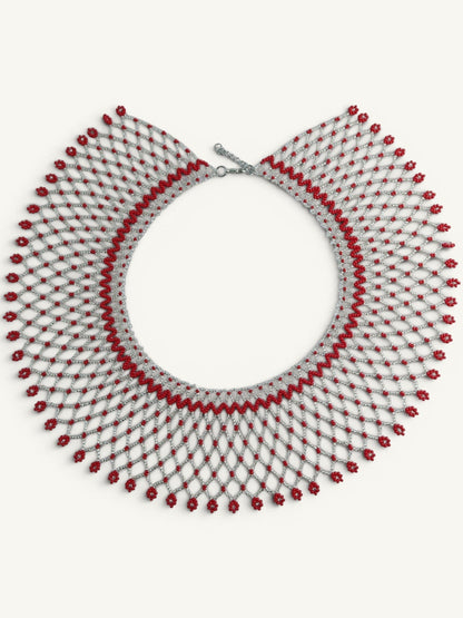 Comely UA Silyanka Solar Crown necklace with red floral bead accents on a silver net pattern. Adjustable clasp.