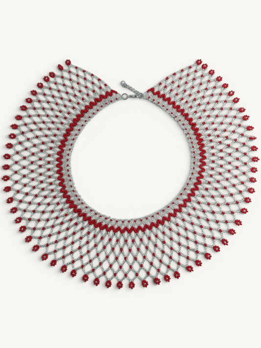 Comely UA Silyanka Solar Crown necklace with red floral bead accents on a silver net pattern. Adjustable clasp.