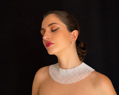 Comely UA white beaded choker necklace, a modern interpretation of traditional Ukrainian silyanka, with a net-like pattern.