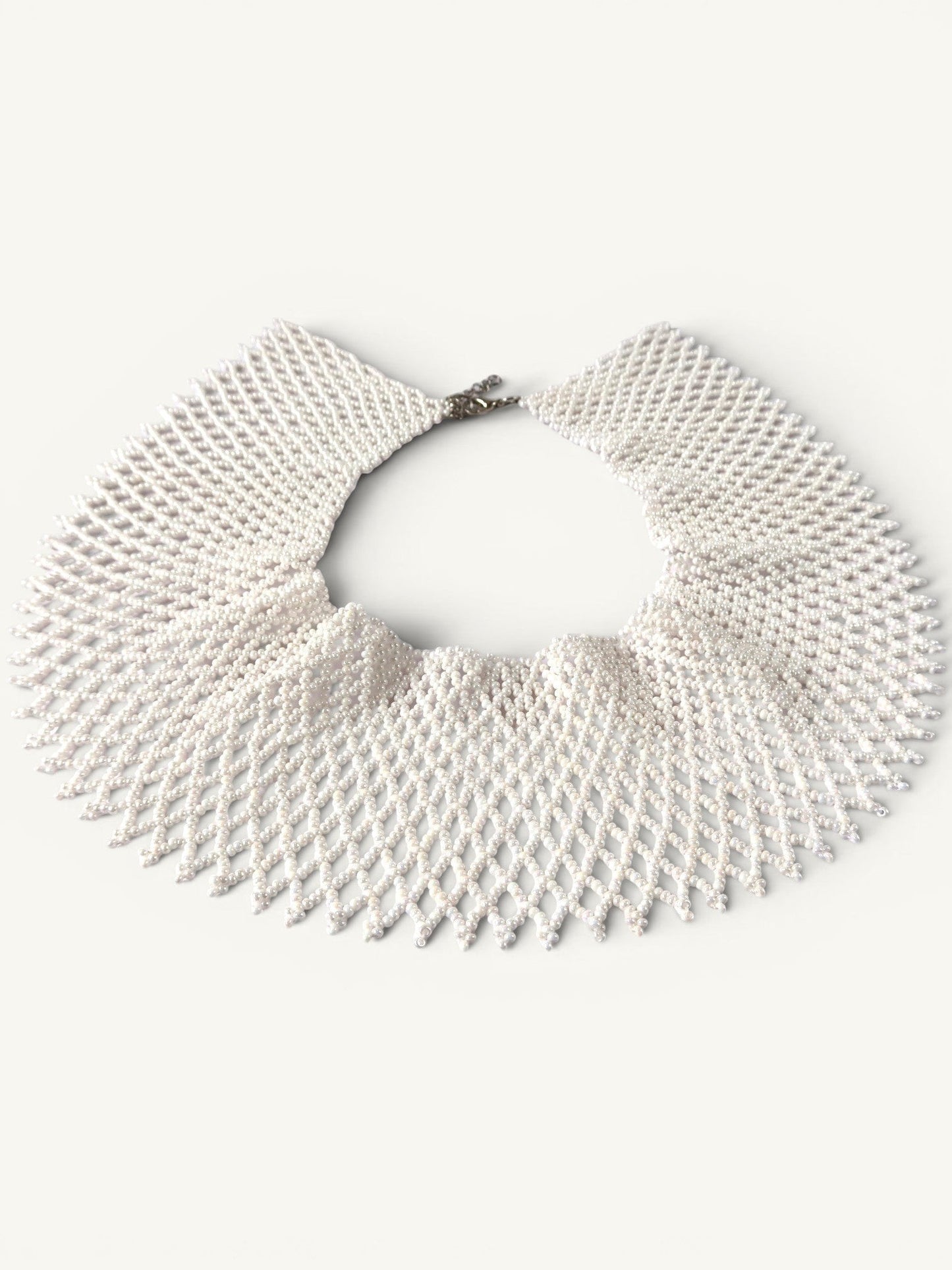 Comely UA white beaded necklace, a flat choker with a diamond pattern, inspired by Ukrainian silyanka tradition.
