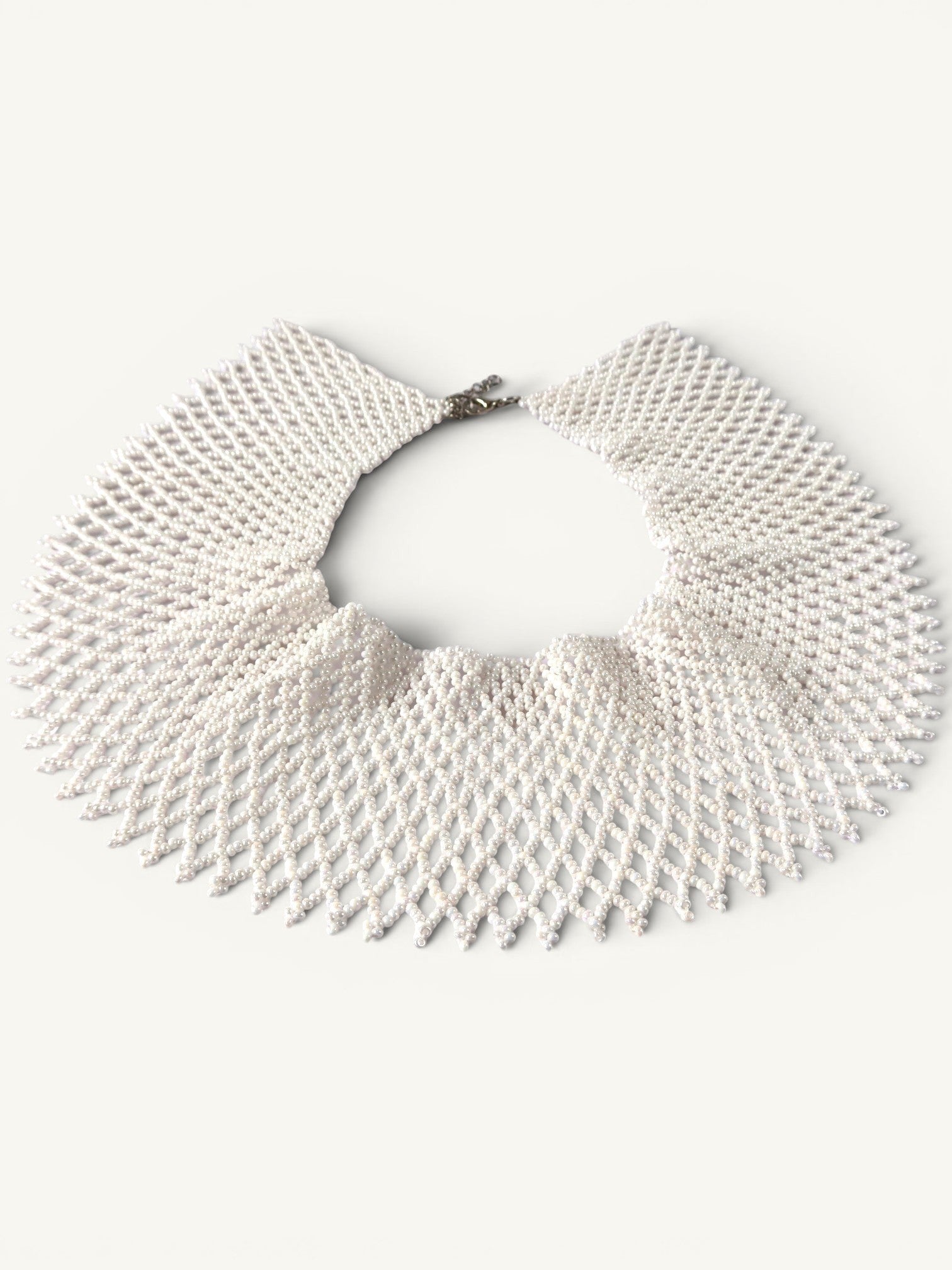 Comely UA white beaded necklace, a flat choker with a diamond pattern, inspired by Ukrainian silyanka tradition.