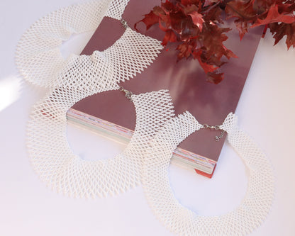 Comely UA white beaded silyanka necklace with intricate net-like pattern and silver clasp. A statement choker.