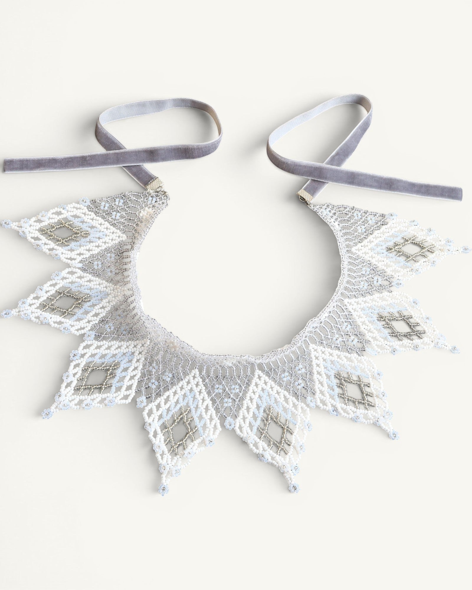 Comely UA white and silver beaded lace collar necklace with diamond motifs and velvet ties.