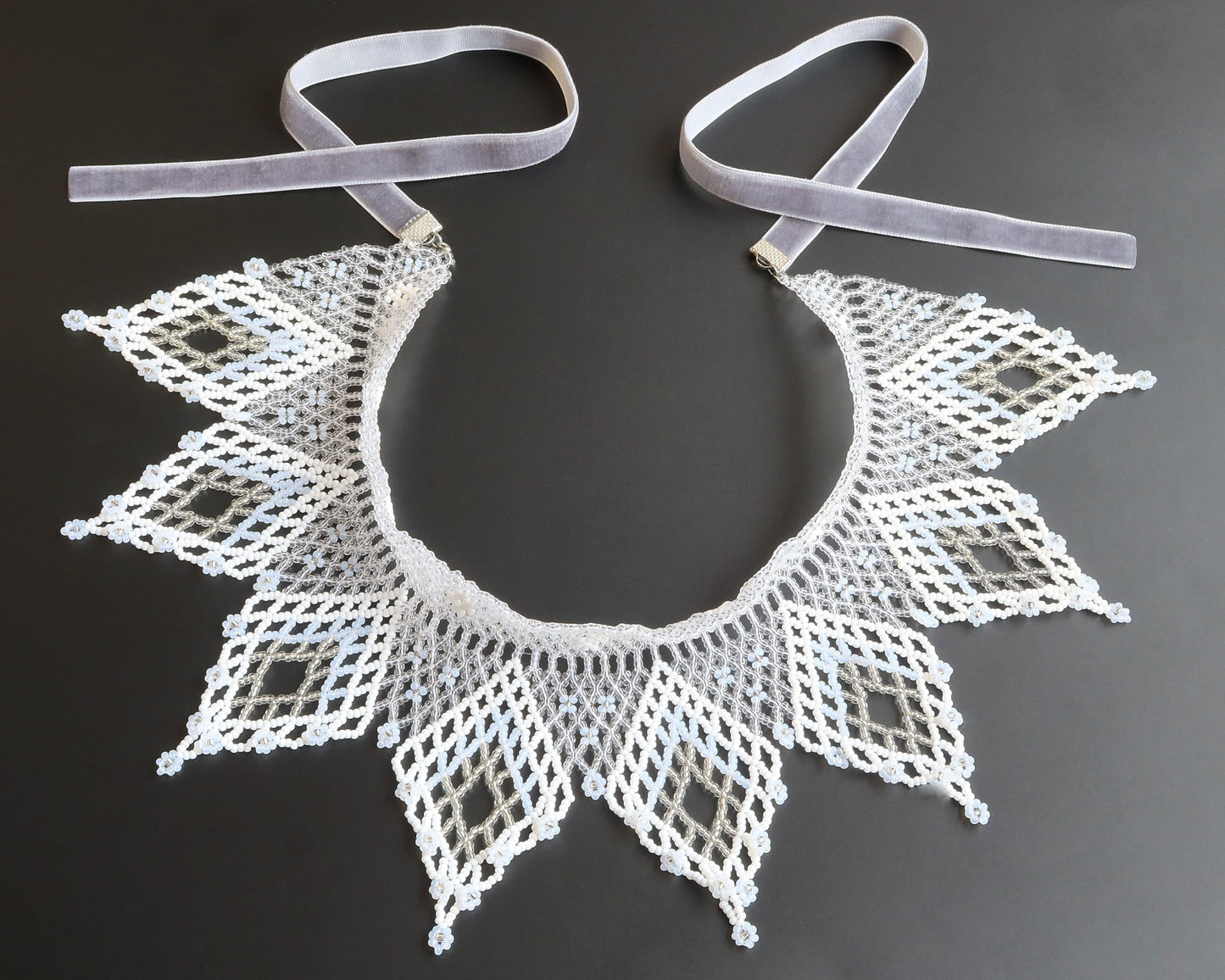 Comely UA white and silver beaded lace collar necklace with diamond motifs and floral ends, velvet ribbon ties.