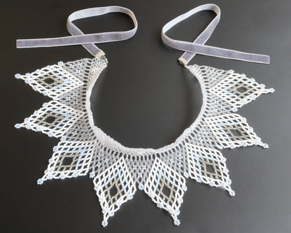 Comely UA white and silver beaded lace collar necklace with diamond motifs and floral ends, velvet ribbon ties.