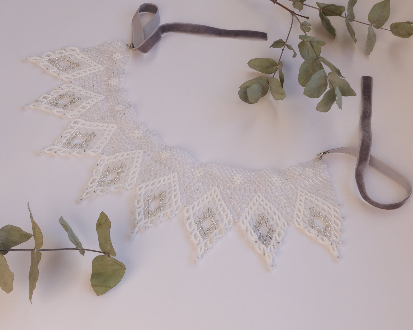 Comely UA white and silver beaded necklace with diamond motifs and floral ends, made with Czech seed beads and velvet ribbon ties.