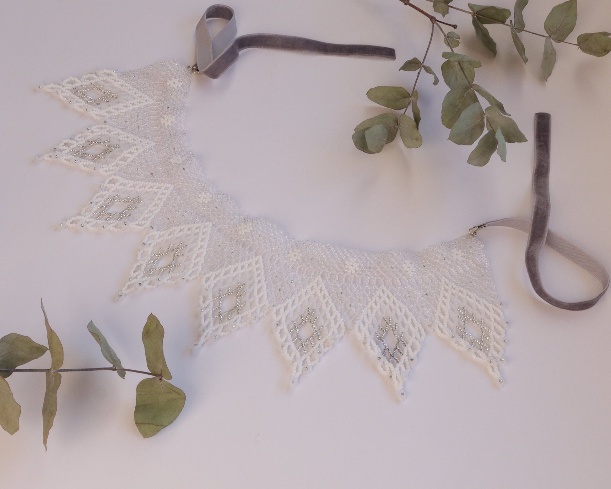 Comely UA white and silver beaded necklace with diamond motifs and floral ends, made with Czech seed beads and velvet ribbon ties.