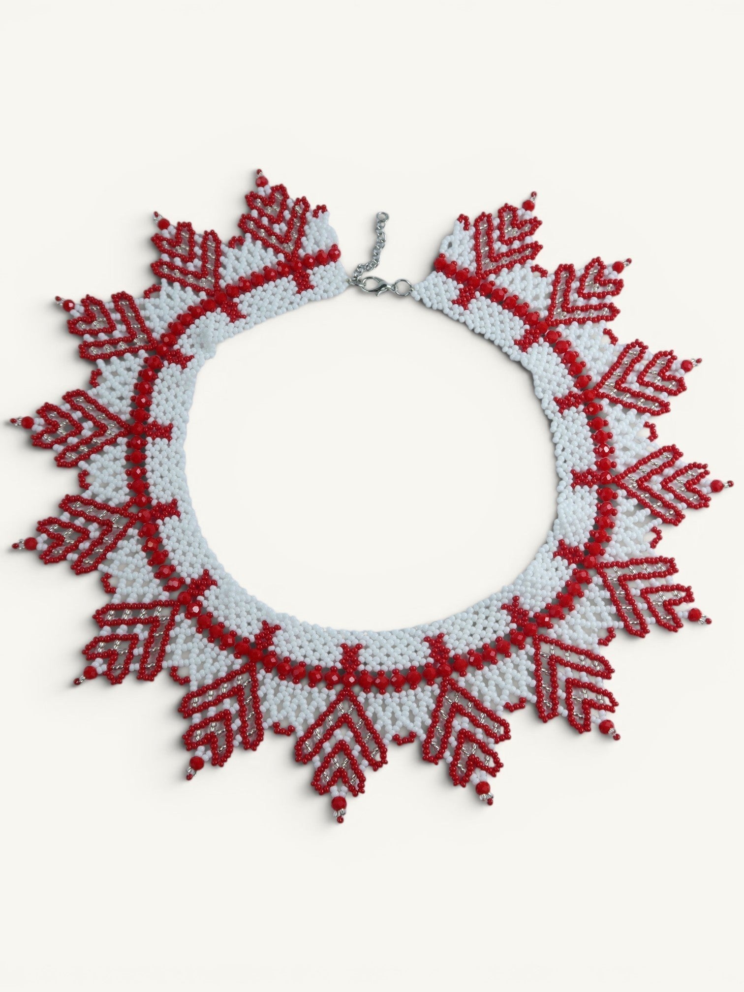 Comely UA "Zakhrava" beaded necklace in white and red with jagged sunray design. Czech seed beads.